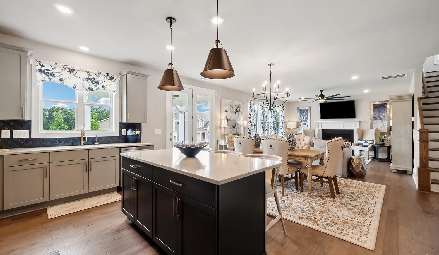 Open concept kitchen and living room in a new home at Willow Cove community in Canton, Georgia