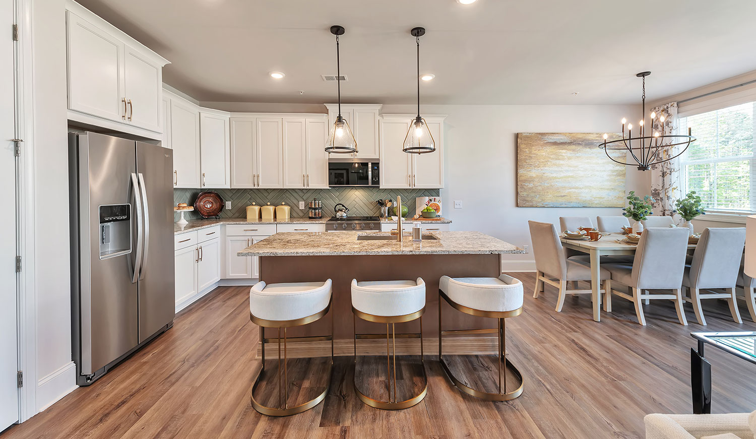 Open concept kitchen and dining room in a new home at Crestwood community in Marietta, Georgia