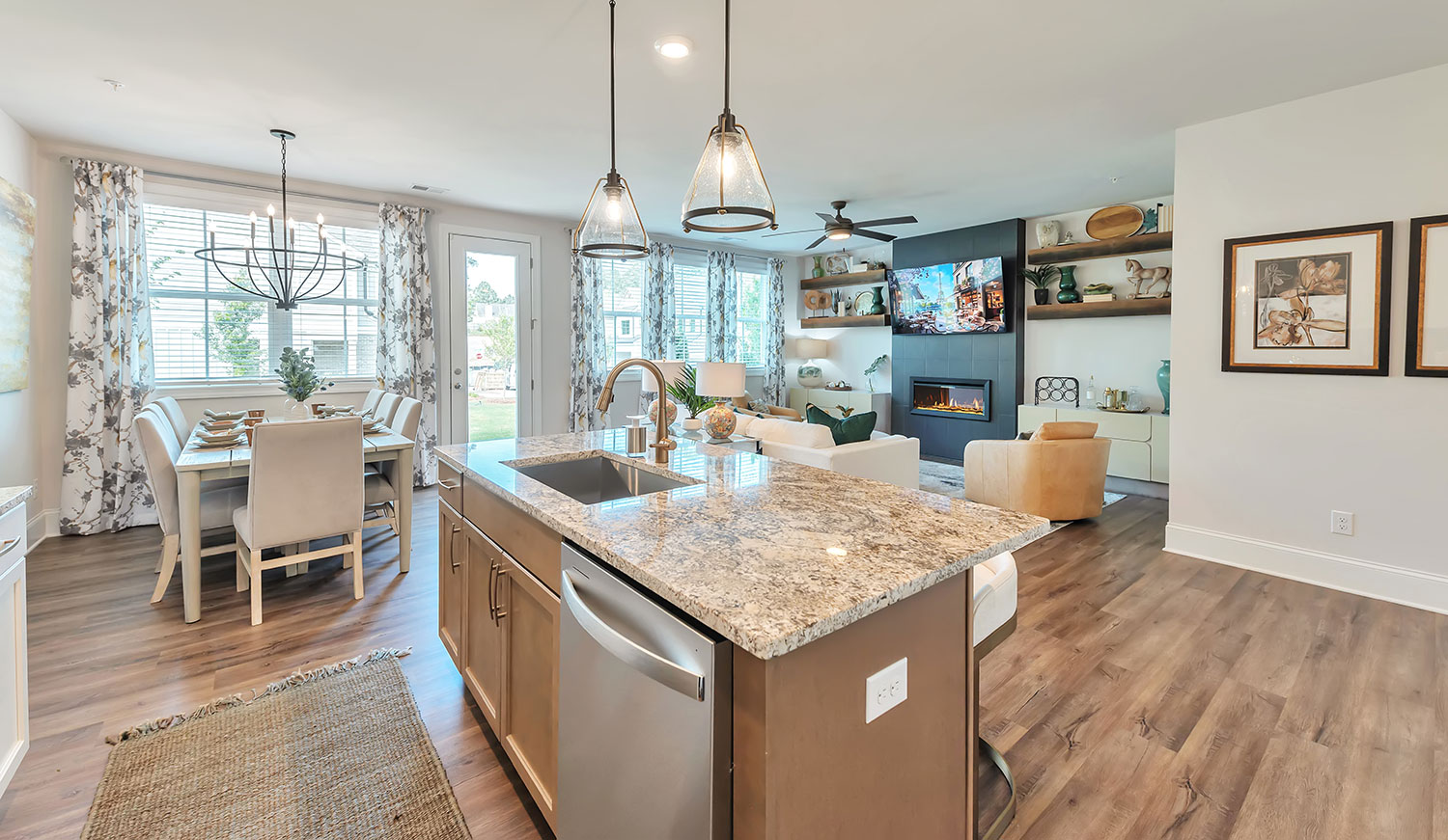 Open concept kitchen, dining room and living room in a new home at Crestwood community in Marietta, Georgia